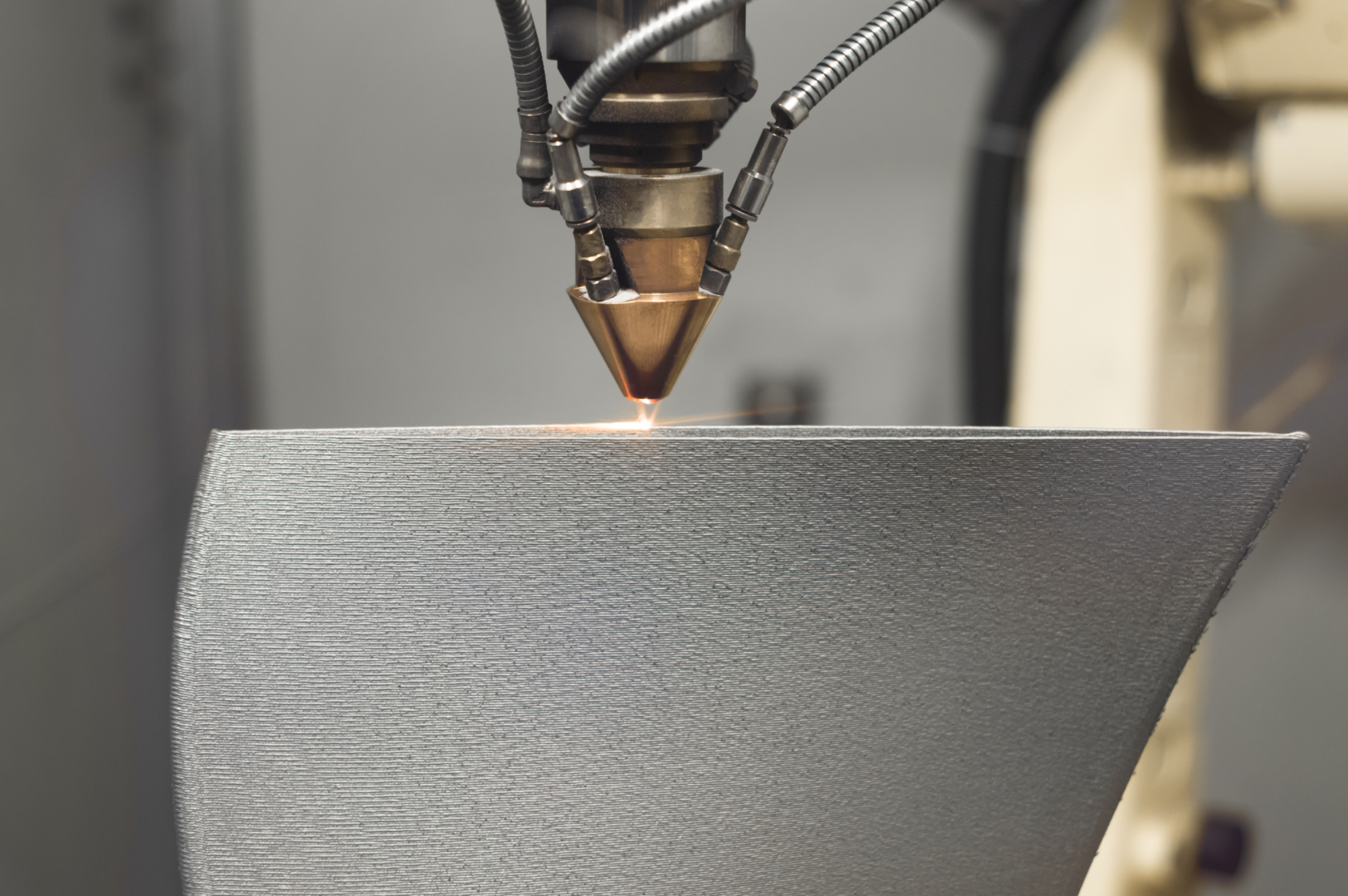 Directed energy deposition (DED) simultaneously sprays and melts metal powder onto damaged turbine blades for repair, or builds them from scratch.
